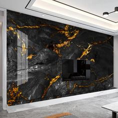 a large black and gold marbled wall in a living room with a tv mounted on the wall