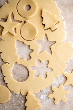 cookie dough cut out to look like christmas trees and bakes on a baking sheet