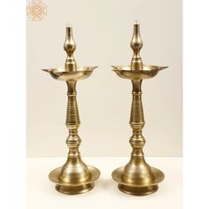 When a devotee's prayers are granted, he or she typically presents a light to the god in question, which is known as dev danam. A votive offering is shaped like a lamp. It is recommended to associate the lamp with some spiritual imagery to boost its auspiciousness and to complete the lamp's identification as a heavenly vehicle for transmitting prayers. This brass statue with a single lamp and a crown embellished with a peacock picture is said to be a perfect Dev Deepam. It is used not just as a Peacock Lamp, Peacock Pictures, Brass Statues, Curtain Accessories, Book Art Drawings, Brass Metal, Garden Lighting, Pink Yellow, Lighting Fixtures