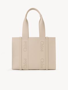 Chloé Medium Woody Tote Bag | Chloé US Beige Calf Leather Tote Bag, Beige Calf Leather Shoulder Bag For Shopping, Beige Calf Leather Bag With Dust Bag, Calf Leather Tote Shoulder Bag With Handles, Calf Leather Shopping Bag With Double Handles, Calf Leather Tote Shoulder Bag, Calf Leather Tote Shoulder Bag For Shopping, Calf Leather Tote Bag For Shopping, Chloe Bags Handbags