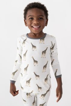 From the first time your little one puts them on, these adorable giraffe print toddler pajamas will be a favorite for nighttime fun! Crafted from ultra-soft bamboo fibers, these cozy pjs will keep your little one comfortable and warm all night long. The fun animal print and bold colors make it easy to express their unique style and personality. Whether they're having a sleepover with friends or just ready for bed, these pjs are perfect for any night of the week. Cozy Pjs, Long Sleeve Pajamas, Toddler Pajamas, Giraffe Print, Long Sleeve Pyjamas, Toddler Fashion, Story Time, Bold Colors, Pajama Set