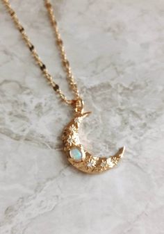 "Dainty 14K gold plated crescent moon charm necklace opal & CZ -------------------- Detail *Opal and cubic zirconia moon charm measures 8 x 13 mm *16K gold plated hammered chain -------------------- Necklace Length *This necklace is available in 3 sizes. 14\" - 16\" (14\" + adjustable 2 - inch extender) 16\" - 18\" (16\" + adjustable 2 - inch extender) 18\" - 20\" (18\" + adjustable 2 - inch extender) *It closes with lobster clasp. --------------------- Jewelry care *Plated brass items are e Crescent Moonstone Necklace In Gold, Gold Crescent Moonstone Necklace, Gold Moonstone Necklace With Moon Charm, Dainty 14k Gold Filled Crescent Necklaces, Crescent Moonstone Gold Jewelry, 14k Gold Filled Crescent Moon Necklace, Delicate Gold-plated Jewelry With Moon Charm, Dainty Crescent Gold Plated Necklace, Delicate Gold Plated Jewelry With Moon Charm