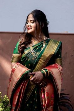 a woman in a green and red sari