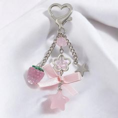 Elevate your accessory game with our Cute Pink Strawberry Bow Keychain! This charming keychain blends playful design with a touch of nostalgia, perfect for women and girls who adore the Y2K aesthetic. The eye-catching pink strawberry bow serves as the focal point, bringing a sweet and whimsical vibe to any ensemble. The keychain features an intricate star flower tassel that adds a touch of sparkle and movement, along with a heart-shaped charm that symbolizes love and affection. Each element is meticulously crafted to enhance its beauty and durability, ensuring it remains a favorite accessory for years to come. Designed with versatility in mind, this beaded chain keychain is not just for keys. It makes a fantastic phone decoration, bag charm, or even a unique zipper pull. The vibrant colors Pink Keychain, Heart And Key, Heart Keychain, Jewelry Accessories Ideas, Star Flower, Everyday Items, Delicate Details, Cute Pink, Playful Design