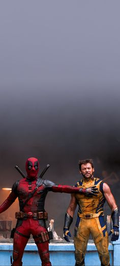 two deadpools standing next to each other