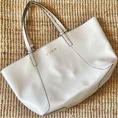 Ever Skincare By Stella & Dot Branded Tote Bag. White Vegan Leather Exterior W/ Black Trim, Reversible To Gold Interior. No Hardware Or Closure. 9”W X 6”H Detachable Wristlet W/ Zipper Closure Included. Wristlet Is Also Reversible: White On One Side W/ Gold Magnolia Print On The Other. Please Note Although Never Used, The Gold Lining Interior Has Puckered / Delaminated In Places But There Are No Tears In The Finish. 22”W (At Top; 14-1/2”W At Bottom) X 12”H X 6”D. 9” Drop Handles. Smoke Free, Pet White Everyday Bag With Handle Drop, Everyday White Satchel With Handle Drop, Everyday White Tote Bag, White Daily Tote Bag, White Everyday Bags, Magnolia Print, Branded Tote Bags, Vegan Leather Tote Bag, Vegan Leather Tote