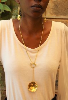 Handmade in Nairobi , Kenya! Crafted with brass pendants. Clasp is located in the front. Necklace length- 40.5cm Earrings length- 7cm SHIPPING Shipping is done via DHL Express, 3-7 days delivery, Add multiple items to your cart and pay shipping for one item ONLY! Gold Medallion Necklace With Detachable Pendant As Gift, Brass Medallion Necklace With Chain As Gift, Brass Medallion Necklace As Gift, Gold Plated Chain Necklace With Detachable Pendant As Gift, Gold Metal Drop Necklace As A Gift, Gold Metal Drop Necklace For Gift, Gold-tone Brass Jewelry With Detachable Pendant, Gold Drop Necklace With Detachable Pendant As Gift, Brass Toggle Necklace Gift