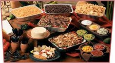 a table full of food and condiments for a party or gathering with the caption's name on it