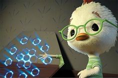 an animated chicken wearing glasses and standing next to a computer screen with blue light coming from it