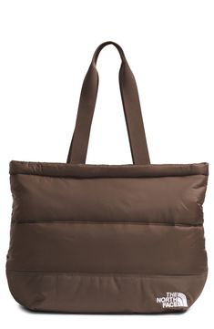 This comfortable, all-purpose tote for on-the-go days is made from durable ripstop complete with recycled synthetic insulation. It has interior organization with zip pockets to provide secure and easy-to-access storage. Top zip closure Top carry handles Exterior secure-zip pocket Laptop sleeve fits most 13" laptops; mesh pocket with key hook Lined, with recycled synthetic insulation 40-denier recycled nylon ripstop Hand wash, dry flat Imported Packable Tote Bag For Outdoor, Outdoor Packable Tote Bag, Brown Everyday Bags With Reinforced Handles, Brown Nylon Bags With Double Handle, Brown Bag With Double Reinforced Handles, Brown Tote Bag With Reinforced Handles, Brown Nylon Bag With Removable Pouch, Large Capacity Brown Nylon Bag, The North Face Nylon Bags For Daily Use