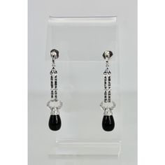 This is part of Chairish’s Fine Jewelry assortment.  These lovely earrings are set with round Diamonds, baguette Diamonds and pave Diamonds all with an Onyx drop. They are 2 1/4" long, Onyx is 9.17cm wide x 12.55cm long and weight 11.9 grams. These earrings are from Spain and the setting is gorgeous, baguettes alternate between round Diamonds with a pave of Diamonds heading the Onyx. Perfect you will keep these in your collection forever. I love black onyx and I do have a few important pieces bu Classic Polished Diamond Earrings For Evening, Elegant Linear Drop Earrings With Polished Finish, Evening Jewelry With Baguette Cut, Elegant Drop Diamond Earrings For Formal Occasions, Elegant Evening Jewelry With Baguette Cut, Elegant Baguette Cut Jewelry For Evening, Diamond Drop Linear Earrings For Evening, White Gold Baguette Cut Earrings For Evening, Luxury Pierced Diamond Earrings For Evening