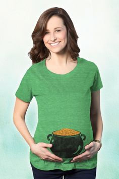 This St. Patrick's Day, show off your growing little treasure with our adorable 'Pot of Gold' maternity t-shirt! Designed to provide comfort and style for expecting mothers, this tee comes in a wide range of sizes to fit your baby bump perfectly. Embrace the spirit of the holiday with this playful top that's perfect for parades, parties, or just enjoying the day with loved ones. Let the world know that you're carrying precious cargo—your very own pot of gold! #MaternityStyle #StPatricksDay 🍀💚 Cute Maternity Cotton T-shirt, Funny Maternity, Casual Maternity T-shirt With Funny Print, Maternity Wear Graphic Print Crew Neck T-shirt, Maternity Shirts, Maternity Cotton T-shirt With Graphic Print, Funny Pregnancy Shirts, Maternity Cotton T-shirt With Funny Text, Tshirt Printing