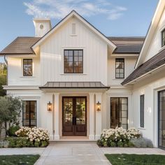 a white house with black trim and windows