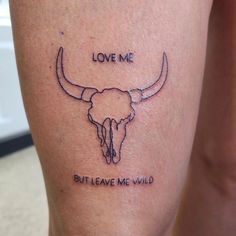 a tattoo on the leg of a woman that says love me but leave me wild