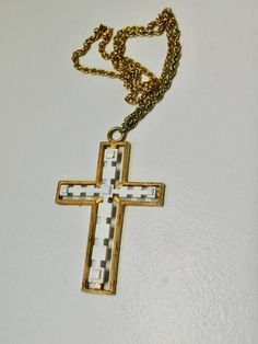 Vintage BEELINE Gold Tone Rope Chain with Gold tone and White Enamel Crucifix Pendant Necklace.Metal Beeline hangtag at the spring closure of chain.The Crucifix it is not signed and I am not sure if it is Beeline.  As Found.Rope Chain Measures 44" L.The Crucifix it is 3- 3/4" H.  x. 2- 3/8".Great color.No damage.Much better in Person.Great condition. Vintage White Cross Jewelry, Crucifix Necklace, White Enamel, Rope Chain, 4 H, Gold Tones, Pendant Necklace, Chain, Pendant