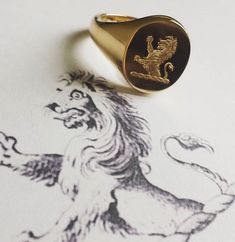 heavyweight classic oxford oval signet ring, ideal for larger gents sizes, 13x16mm oval, 3mm thick, extra thick shank, Quality hand engraving with over 35 years international award winning years experience. weight 9ct - 12grams 14ct - 14.5grams 18ct - 16grams This listing offers free hand engraved family crest or monogram (initials) Creating a Signet Ring 1. We start by stamping the ring from a solid gold metal plate.This is ideal for engraving as it leaves a perfectly flat surface. 2. Our skill Oval Signet Ring, Gold Bullion Coins, Gold Bullion, Gold Signet Ring, Family Crest, Monogram Initials, Hand Engraving, Yellow Rose, Signet Ring