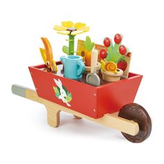 a wooden toy wagon filled with gardening items