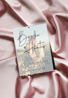 a book with writing on it laying on a pink cloth covered in satin material and the title broke my heart