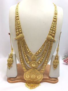 Handmade Indian Jewelry Asian Wedding Bridal Jewellery Party Ethnic Wear 22ct Gold Plated Bridal Necklace Set Rani Haar Bridal Jewellery Set  PLEASE NOTE, This Item Is Not Real Gold .Only Good Quality Gold Plated Jewellery .it is Artificial Jewellery.  It is a perfect match with formal attire on special occasions or with casual wearing.  Slight Colour variations possible due to difference in screen and photograph Care instructions Keep Jewellery away from direct heat, water, perfumes, deodorants Gold Temple Jewelry Tikka For Eid, Gold Wedding Sets For Diwali, Bollywood Gold Sets With Intricate Design, Gold Bollywood Traditional Wear For Wedding, Bollywood Style Gold Traditional Wedding Wear, Wedding Gold Sets With Cutdana, Bollywood Style Gold Traditional Wear For Wedding, Gold Kundan Necklace For Eid, Gold Kundan Necklace With Cutdana For Eid