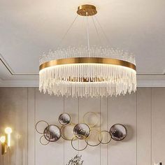 a chandelier hanging over a dining room table