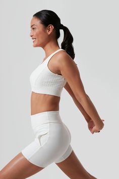 Tnuck Sport combines technical fabrics with stylish silhouettes to move with you as you play all day. From morning coffee runs to marathons, these pieces were designed with busy lifestyles in mind and are as functional as they are chic.Long enough to wear solo with the matching tennis short or but streamlined enough to wear under a sport dress, this cane detailed bra was designed for support and comfort without compromising style and shape. Featuring a power mesh interior with compression and wi Mesh Sports Bra With Built-in Padding For Yoga, Compressive Sports Bra With Built-in Padding For Light Sports, Mesh Sports Bra With Built-in Padding For Gym, Mesh Sports Bra With Built-in Padding For Workout, Supportive Activewear With Built-in Padding For Light Sports, Sports Bra For Light Sports With Medium Support, Yoga Sports Bra With Built-in Padding And Mesh Material, White Nylon Activewear With Built-in Padding, White High Stretch Sports Bra For Running