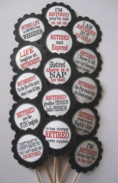 a bunch of badges that are on top of a stick with words and phrases in them