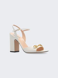 Find GUCCI Horsebit Sandals on Editorialist. Gold-toned hardware Horsebit detail Ankle buckle closure Mid-heel Heel Height: 2. 9 inches Dimensions: Listed in IT sizing. Fits true to size Composition: Upper: 100% Leather; Sole: 100% Rubber Care: Care according to label White Gucci Heels, Luxury Heels With Rectangular Buckle For Evening, Luxury Leather Heels With Rectangular Buckle, Gucci Ankle Strap Heels With Gold-tone Hardware, Gucci Party Heels With Buckle Closure, Gucci Ankle Strap Sandals With Buckle, Gucci Ankle Strap Sandals With Buckle Closure, Elegant Sandals With Sculpted Heel And Rectangular Buckle, Luxury Heels With Tang Buckle