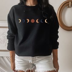 Why Hello! Our high quality super soft unisex sweatshirts & hoodies (Gildan 1800/Gildan 18500) are designed by some talented individuals and handmade with the love of shop cuda team. ◖placing an order is easy peasy lemon squeezy◗ select the style + color followed by the size (PLEASE NOTE: these are unisex sweatshirts so make sure to check out our sizing guide located in the listing) next, add to cart and take advantage of our discount codes listing below! personalization request link: https: Black Long Sleeve Top With Moon Print, Black Moon Print Crew Neck Top, Black Crew Neck Top With Moon Print, Casual Crew Neck Top With Moon Print, Long Sleeve Cotton Tops With Moon Print, Cotton Long Sleeve Tops With Moon Print, Long Sleeve Cotton Top With Moon Print, Fall Cotton Top With Moon Print, Cotton Tops With Moon Print For Fall