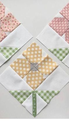 four different types of quilts are arranged in the shape of flower petals and dots