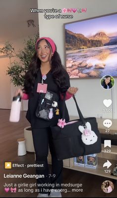 a woman holding a black bag in front of a tv screen with pictures on it