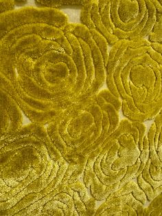 closeup of yellow fabric with flowers on it