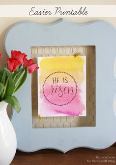 an easter printable is displayed in front of a vase with tulips on it