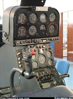 an airplane cockpit with multiple gauges and dials