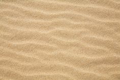 the sand is very soft and has little ripples in it's surface,