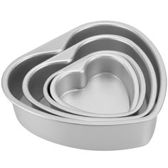 heart shaped pans are stacked on top of each other