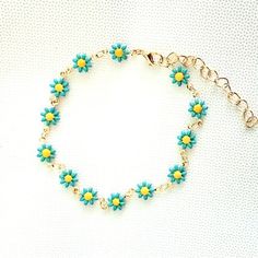 Dainty Blue Enamel Daisies With Yellow Center In A Gold Toned Bracelet. Bracelet Approx. 6.5” With A 2” Extension More Color Options Available. Multicolor Necklace Also Available. See My Other Listings For More Jewelry. Bundle And Save On Shipping. #B3 Trendy Blue Jewelry For Spring, Blue Flower Bracelets For Beach, Trendy Blue Flower Shaped Jewelry, Light Blue Flower Jewelry For Spring, Light Blue Bracelets For Summer Gifts, Adjustable Turquoise Bracelets For Spring, Light Blue Summer Bracelets Perfect For Gifts, Light Blue Bohemian Bracelet For Summer, Blue Flower-shaped Jewelry For The Beach