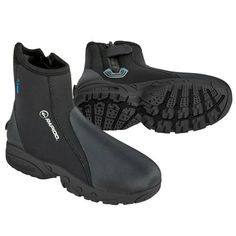 a pair of black boots with blue accents on the soles and side zippers