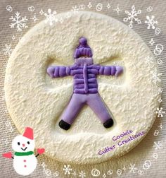 a decorated cookie with a snowman on it