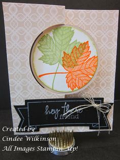 a close up of a greeting card with a leaf on it and a ribbon around the edge