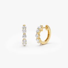 Indulge in sophistication with our 14K Solid Gold Round Diamond Huggie Hoop Earrings. These delicate mini hoops showcase 0.80 carats total weight of authentic round diamonds, imparting a radiant charm to any ensemble. Ideal for birthdays, these elegant diamond hoops seamlessly combine luxury and versatility, becoming a timeless treasure in your jewelry repertoire. Item Details * Gold Kt: 14K Solid Gold * Custom Gold Color:  Yellow Gold, White Gold * Inner Diameter: 10 MM * Outer Diameter: 13 MM * Round Diamonds: 10 pcs 2.7 MM * Diamond CTW: 0.80 ctw (pair) * Diamond Color-Clarity: G Color SI Clarity * Ready to Ship in 1-2 Business Days ▶ See more of our Diamond Earrings - http://etsy.me/2lyqVBP ▶ See our storefront here - http://etsy.me/2lUcVnH  ▶ All store sections here * Diamond Rings - Yellow Gold Hoop Earrings With Brilliant Cut For Anniversary, Dazzling Brilliant Cut Huggie Earrings For Anniversary, Wedding Yellow Gold Diamond Huggie Earrings, Timeless Huggie Earrings With Prong Setting For Wedding, Luxury Huggie Earrings With Prong Setting For Weddings, Classic Wedding Huggie Earrings With Brilliant Cut, Wedding Huggie Earrings With Brilliant Cut Diamonds, Wedding Diamond Huggie Earrings With Brilliant Cut, Timeless Wedding Huggie Earrings With Prong Setting