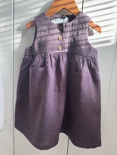 This linen dress is gorgeous and perfect for all seasons and occasions.  Made from high quality soft fabric 100% linen. Sleeveless.  Avalible sizes (child height ): - EU80 (31,50 inch) 9-12Months - EU86 (33,86 inch) 12-18M - EU92 (36,22 inch) 18-24M - EU98 (38,58 inch) 2-3Years - EU104 (40,94 inch) 3-4Y - EU110 (43,31 inch) 4-5Y - EU116 (45,67 inch) 5-6Y - EU122 (48,03 inch) 6-7Y  - EU128 (50,40 inch) 7-8Y The item is made to order and it takes about 3-5 days to go and will be shipped immediatel Sleeveless Cotton Linen Dress With Pockets, Sleeveless Linen Sundress With Pockets, Sleeveless Cotton Dress In Flax Color, Sleeveless Pinafore Dress With Buttons For Summer, Beige Sleeveless Cotton Dress, Sleeveless Linen Pinafore Dress With Pockets, Sleeveless Linen-cotton Dress With Pockets, Plum Colour, Muslin Dress