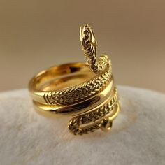 Snake ring made of 18 carat solid yellow gold Snake was the symbol of health in ancient Greece It's made with detailed handmade workmanship Made in Greece in our workshop in Athens A beautiful piece of jewelry that can be an unique gift for any special occasion For more information don't hesitate to contact us SHIPPING INFORMATION FREE SHIPPING VIA DHL EXPRESS Please fill in an active phone number It's required by the courier company DELIVERY TIME INFORMATION 1 - 3 Days EUROPE 3 - 5 Days to U.S. 14k Gold Ceremonial Ring Jewelry, Ceremonial 14k Gold Ring Jewelry, 14k Gold Ceremonial Ring, Ceremonial 14k Gold Ring, Antique Hand Forged Yellow Gold Rings, Heirloom Open Ring Jewelry For Ceremonial, Gold Plated Ring With Intricate Design, Elegant Ceremonial Rings In 14k Gold, Elegant Gold Engraved Ring In Brass