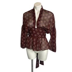 A Fun Burgundy Boho Print Sheer Long Sleeve Tie Waist Blouse From Zara. * Condition: Pre-Owned Consignment W/ Tags * Size: Xs * Pit To Pit: 22" * Length: 23.5" (In Back) Fitted Brown Tops For Daywear, Zara Vintage Fitted Tops, Bohemian Fitted Zara Blouse, Fitted Zara Tops For Daywear, Tie Waist Top, Sheer Long Sleeve, Boho Print, Zara Tops, Red Purple