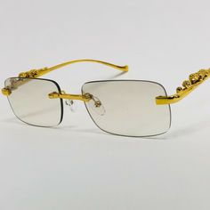 SHIPS FROM THE U.S!!!!!  RECEIVE IT FAST and FREE!!!!!  Metal Square Frame Frameless GOLD Migos Rap Hip Hop Glasses Eye Wear Shades Sunglasses Brand New With Tags Sunglasses. High Quality. Size Details Width  5.75 Inches Height 1.6 Inches   Payment PayPal - Credit Card - Debit Card - Apple Pay - Google Pay Shipping Item will be ship out within 1 business days of receiving your payment. We offer free USPS First Class Mail shipping Refunds We will work with you to make sure you are happy with your Gold Metal Sunglasses For Party, Hip Hop Glasses, Gold Shades, Gold Animals, Rimless Frames, Eye Wear, Shades Sunglasses, Wire Frame, Blue Lenses