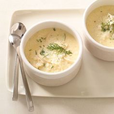 two bowls of chicken soup on a white tray