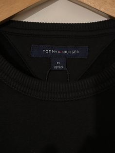 Tommy Hilfiger Stacked EMB Crewneck Black 78J9708 001 Tommy Hilfiger Black Crew Neck Top, Classic Black Tommy Hilfiger Top, Tommy Hilfiger Black Tops For Fall, Black Tommy Hilfiger Tops For Fall, Tommy Hilfiger, The Unit, Crew Neck, Black