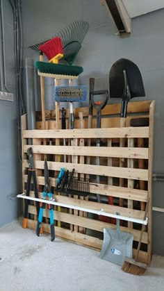 a wooden pallet filled with lots of tools and gardening utensils on top of it