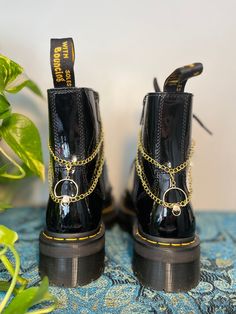 Lunar Lotus Boot Chains are the perfect way to spice up your Doc Martens or Combat Boots!  The chain length fits both Platform and Classic heel heights - Each order comes with a set of two chains of the same style - Each set is handmade. *New* Heavy Gauge Chains with detachable charms for easy mixing and matching! This Set Includes: - 2 Gold Mushroom Charms (Detachable) - Clips: 18k Gold Plated - Chain: Imitation 12k Gold - Fittings: 18k Gold Plated Boot Chains, Moon Gold, Wrap Boots, Floral Moon, Classic Heels, Gold Moon, Star Gift, Shoe Clips, Doc Martens