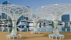 an artist's rendering of a pier with white umbrellas and benches in the foreground