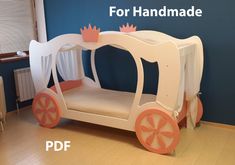 a child's bed made to look like a horse drawn carriage with pink wheels